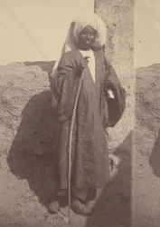 Portrait of a Young North African Man Standing Against a Pillar