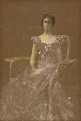 Lady in Rattan Armchair