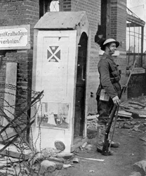 A British soldier on sentry duty after the fall of Peronne, France, First World War