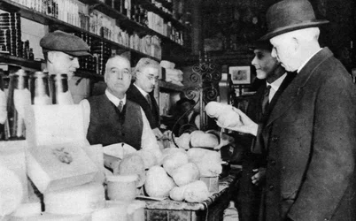A customer inspects a haggis, London