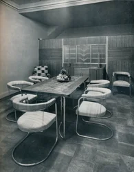 A dining-room suite, with table and chairs of steel tube. By Practical Equipment Ltd., of London