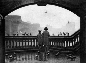 A Man and a Boy Feeding the Birds by Blackfriars Bridge, London