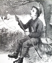 A young boy fishing