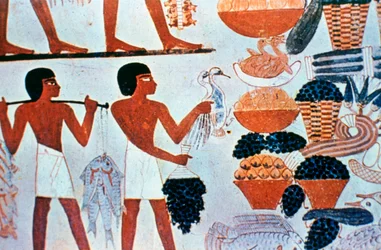 Ancient Egyptian wall paintings in a tomb at Thebes, Egypt