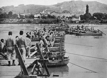 Building a pontoon bridge over a French stream