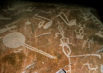 Carved Petroglyph People, deers, elks, birds, boots and circles