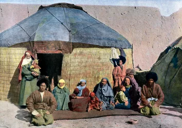 Central Asian Family Outside Their House