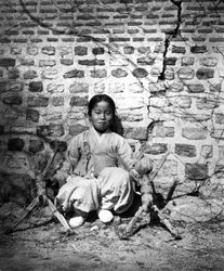 Child Sitting by a Wall, Korea