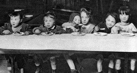 East End children being fed by a charitable organisation, London