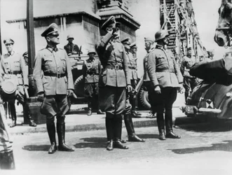 General von Bock saluting German troops parading past the Arc de Triomphe, Paris