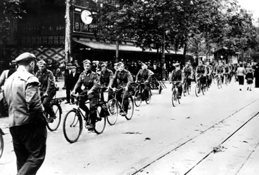 German Soldier Cycling Through the Streets of Paris