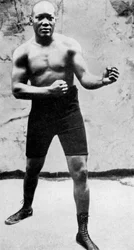 Jack Johnson, the first Black world heavyweight boxing champion, 1908, 1951