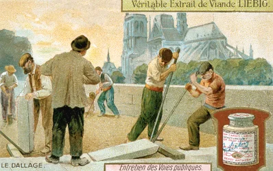 Laying paving slabs in a Paris street, c1900