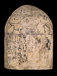 Limestone Stela Depicting the Worship of the Divine Cats of Re and Atum