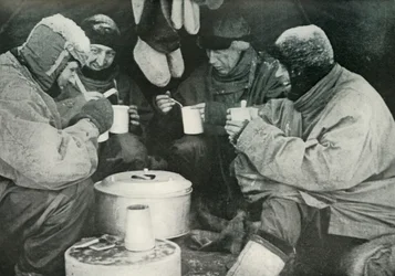 Members of the Polar Party Having A Meal in Camp, c1911