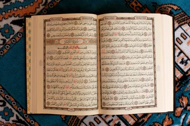 Open Quran and prayer mat, Tunisia