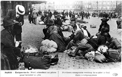 Refugees from the north waiting for a guide to find them lodgings, Paris, World War I, 1914-1918
