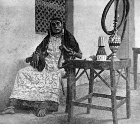 Somali woman smoking a hookah, Aden