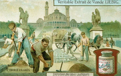Surfacing a road with granite setts, Paris, c1900