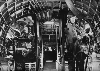 The midship gunners of an RAF flying boat alert at their stations
