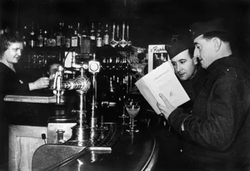 Two French soldiers on leave in a cafe