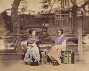 Two Japanese Women Sitting on a Bench