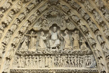 Tympanum of the portal of the Last Judgement: Christ of Judgment. At his side, on his knees, the Virgin Mary and St. John intercede for the salvation of souls. Amiens Cathedral, Amiens, France