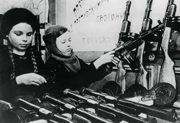 Young girls assembling machine guns in a Russian factory