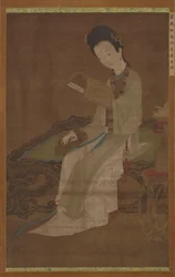 Young Woman Reading a Book of Poems