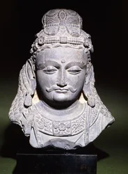 A large head of a Bodhisattva with a downcast expression, 2nd-3rd century