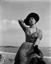 A model wearing Christian Dior fashions in Venice, 3rd June 1951: Black Gloves and Hat