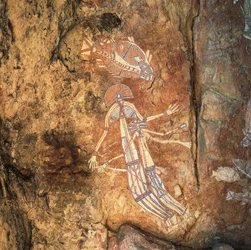Aboriginal rock art of mythical woman and child at Njambolmi near Nourlangie, Arnhem Land, NT, Australia