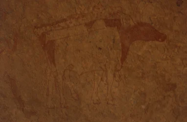 Algeria, Sahara Desert, Tassili-n-Ajjer National Park, site of Sefar, rock painting depicting a bull.