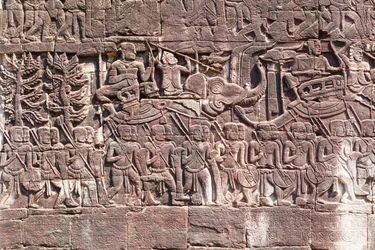 Bas reliefs on the west side of the Bayon Temple depicting Khmer soldiers marching, Angkor archaeological site, Cambodia