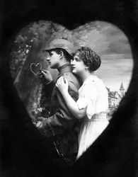 Couple in love: the man carves a heart on a tree before leaving his beloved to go to war (First World War 1914-1918)