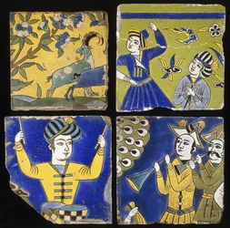 Four Saffavid cuerda seca tiles, depicting two ibex, and the figures of musicians and dancers