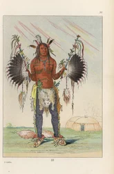 Mandan medicine man Mah-to-he-hah, Old Bear, painted with various colours, bear grease and charcoal, holding feathered medicine pipes and wearing fox tails on his heels. Hand-coloured lithograph from George Catlin