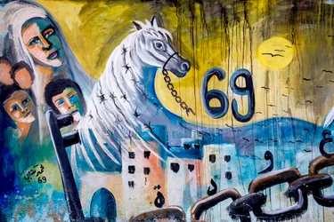 Palestinian wall art on a wall in Jenin, West Bank, Palestine, Palestinian family returning home, 2018