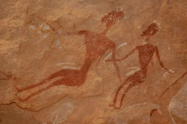 Rock art, Prehistory: Detail of a rock painting of two characters in an ornate shelter, in the Uweinat massif, Egypt (Period from 8000 to 3000 years BC). Photography
