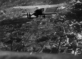 Rome (Italy), circa 1930: Italian Aviation Minister Italo Balbo (1896-1940) flies over the city aboard a 