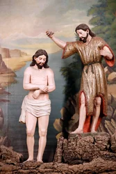 Saint Francis church. The Baptism of Christ by John the Baptist in the water of the river Jordan. Evora. Portugal.