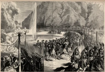 Emperor Napoleon III (1808-1873), followed by his staff crosses the Tuileries Garden in Paris. His son, the imperial prince Eugene Louis Joseph (1856-1879), is on his right. Engraving in 
