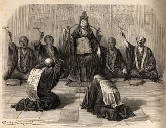 High Buddhist priest being adored, surrounded by his disciples rhythming the ritual with gong and cymbals. Engraving to illustrate the voyage to Japan in 1863-1864, by Aime Humbert, minister of the Swiss Confederation, in Le tour du monde, nouveau journal