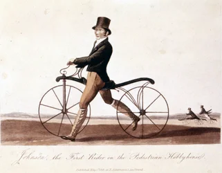 Johnson on a bicycle. This is the model invented by Baron von Drais: the Draisienne. It was made of wood and there were no pedals yet. Color lithography of 1819