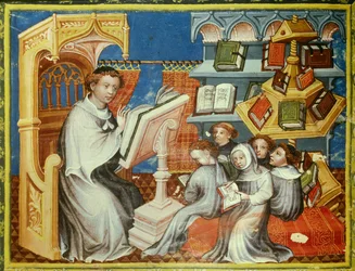Monastic school of the convent of the hermits of Saint Augustine in Paris: a monk on a pulpit reads a lesson with teenagers with tonsures but also with laypeople. On the right, a pound wheel. Miniature in 