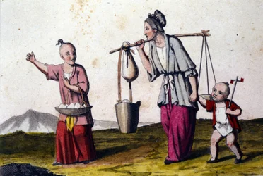A woman carrying water accompanied by 2 children
