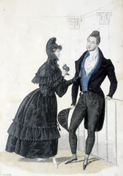 Plate illustrating the masculine and feminine fashion of the 1830s. The woman wears a dress with a hood and holds a prom mask in her hands