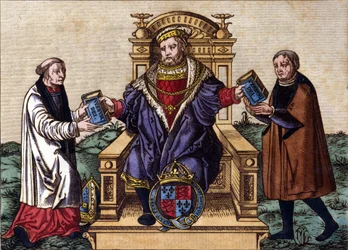 Portrait of King Henry VIII of England (1491 - 1547) on his throne, emitting the Bible to two courtiers. Coloring engraving.