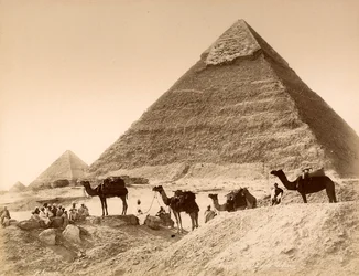 Men and camels in front of the pyramid of Chefren