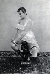 Woman in lingerie around 1885